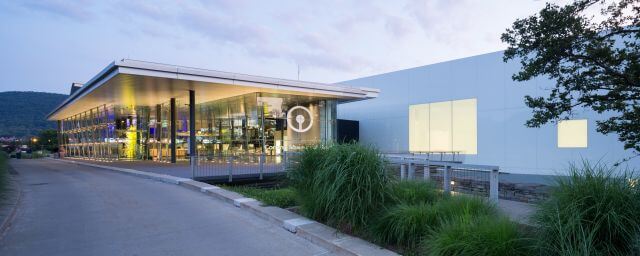 Exterior of the Museum facade showing a bright sculpture illuminated through clear glass windows (Photo: Iwan Baan)