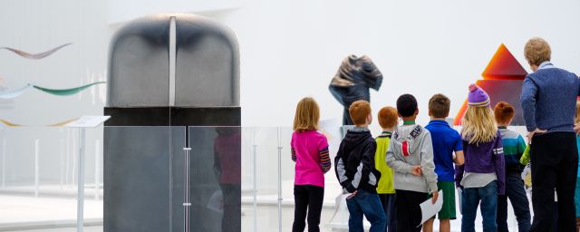 Group of children in the New Glass Now Exhibit