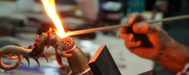 Close up of an artist using flamework